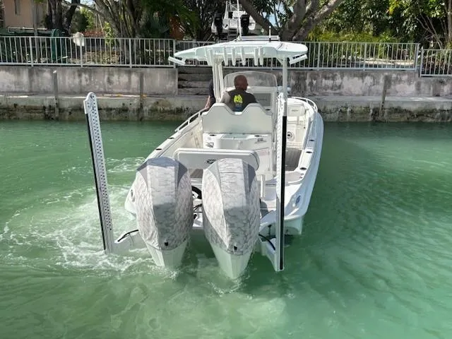 Slide: The Image of 2023 Glasstream 280 Pro-XS boat navigating in clear water, rear view. - 26