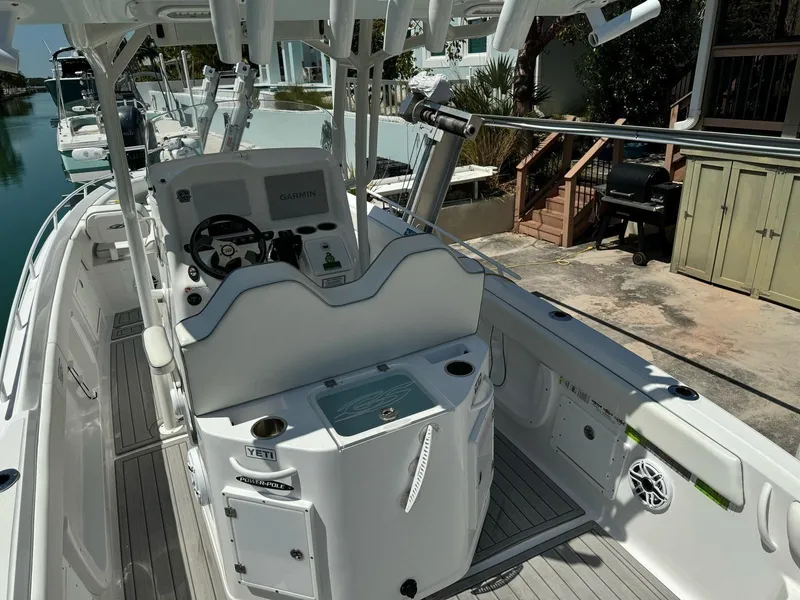 Slide: The Image of 2023 Glasstream 280 Pro-XS boat interior with helm and seating area. - 3