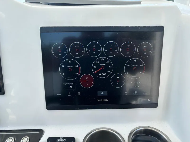 Slide: The Image of Garmin display on 2023 Glasstream 280 Pro-XS boat dashboard, showing various gauges and controls. - 8