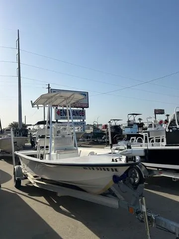 Slide: The Image of 2010 Mako 18 Inshore boat on trailer in sunny outdoor dealership. - 3