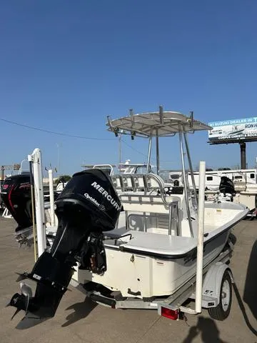 Slide: The Image of 2010 Mako 18 Inshore boat with Mercury outboard motor on trailer. - 6