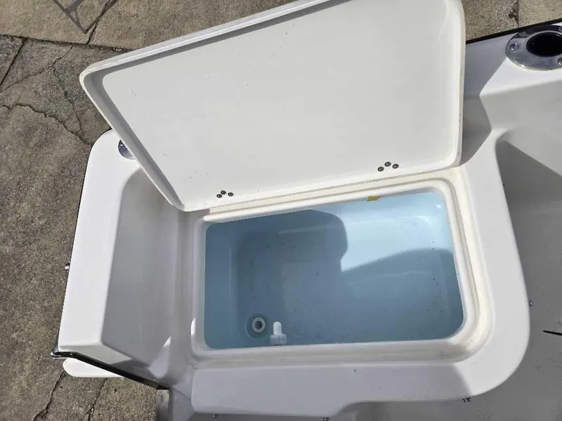 Slide: The Image of Open storage compartment on 2025 Key West 1720 CC boat, showing interior space. - 6