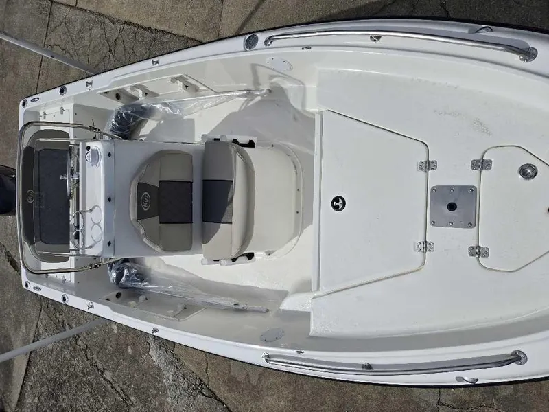 Slide: The Image of 2025 Key West 1720 CC boat interior, featuring seating and console, viewed from above. - 7