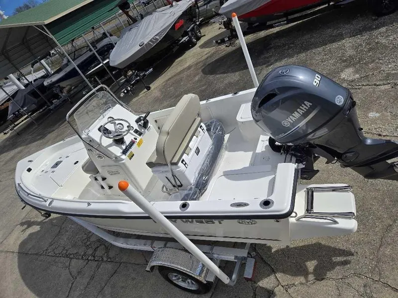 Slide: The Image of 2025 Key West 1720 CC boat with Yamaha engine on trailer in a marina. - 8