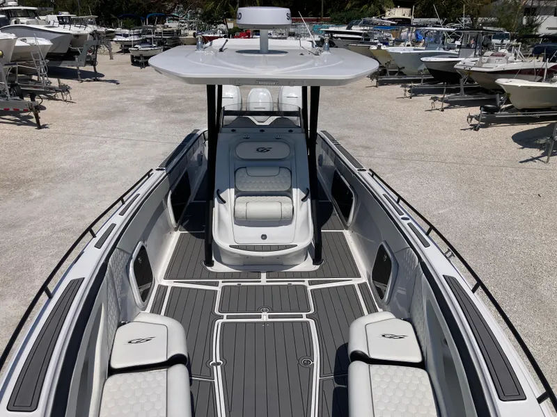 Slide: The Image of 2022 Glasstream 36 PRO boat with sleek design and spacious seating in a marina setting. - 10