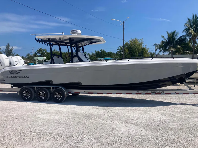 Slide: The Image of 2022 Glasstream 36 PRO boat on trailer, parked outdoors under clear sky. - 2