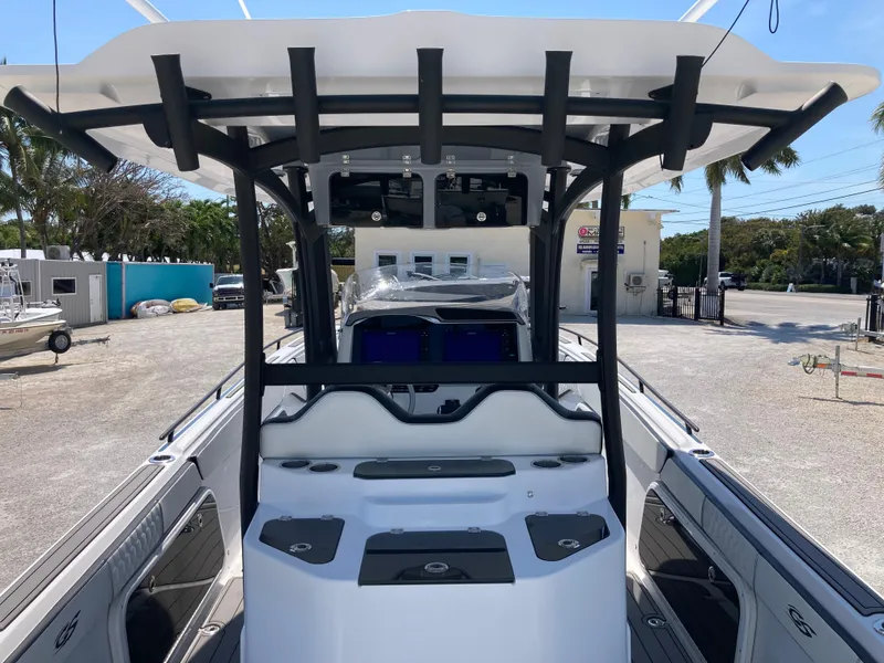 Slide: The Image of 2022 Glasstream 36 PRO boat, center console view, docked outdoors. - 6