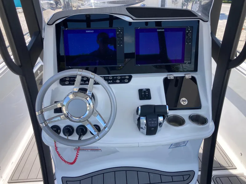 Slide: The Image of 2022 Glasstream 36 PRO boat dashboard with dual screens and modern controls. - 7