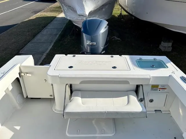 Slide: The Image of 2020 Parker 2320 SL Sport Cabin boat with Yamaha 225 engine, featuring a foldable seat and storage. - 12