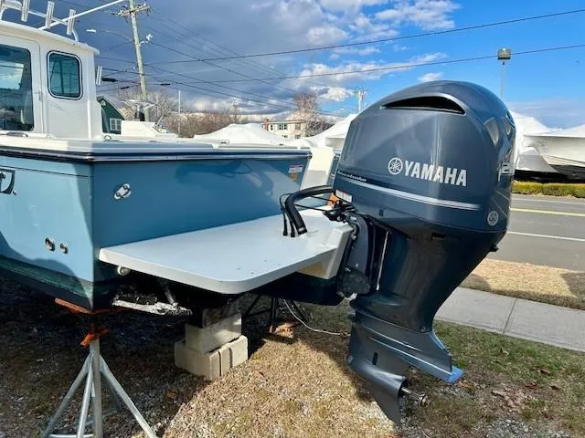 Slide: The Image of 2020 Parker 2320 SL Sport Cabin with Yamaha outboard motor on display. - 16