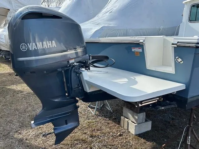 Slide: The Image of Yamaha outboard motor on 2020 Parker 2320 SL Sport Cabin boat, displayed outdoors. - 18