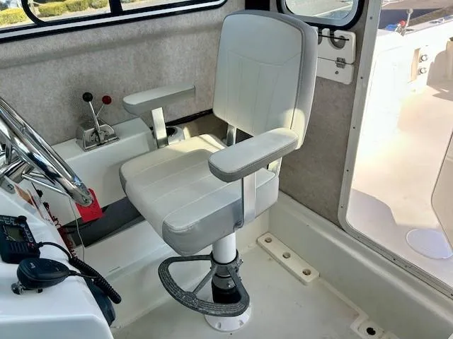 Slide: The Image of Captain's chair in 2020 Parker 2320 SL Sport Cabin boat interior. - 7