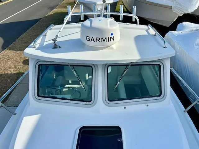 Slide: The Image of 2020 Parker 2320 SL Sport Cabin boat with Garmin radar on top. - 9