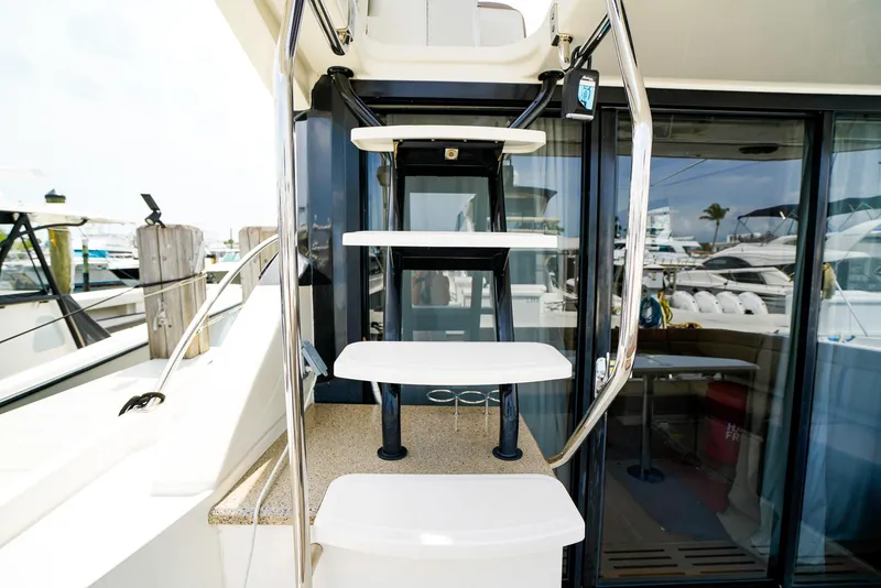 Slide: The Image of Staircase on 2016 Sea Ray 400 Fly yacht, leading to upper deck. - 10