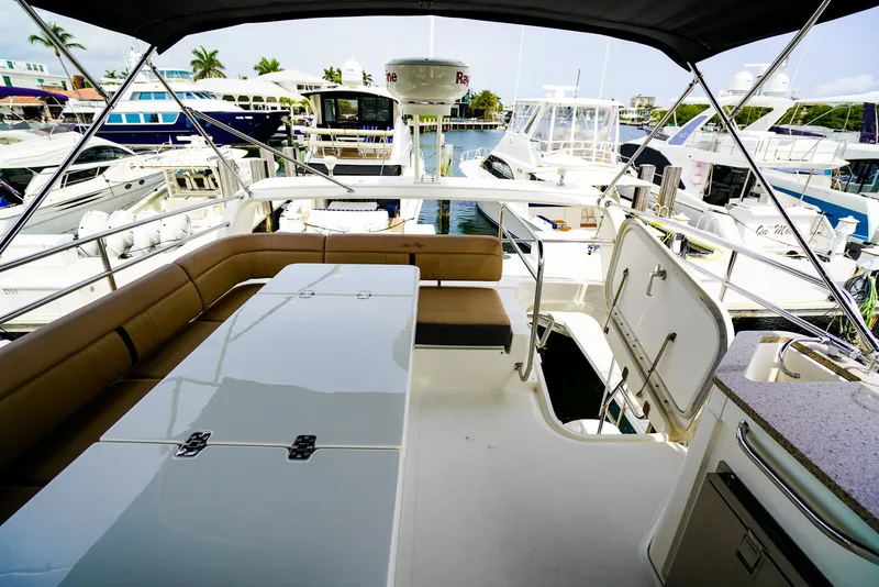 Slide: The Image of Flybridge view of 2016 Sea Ray 400 Fly yacht docked at marina. - 19