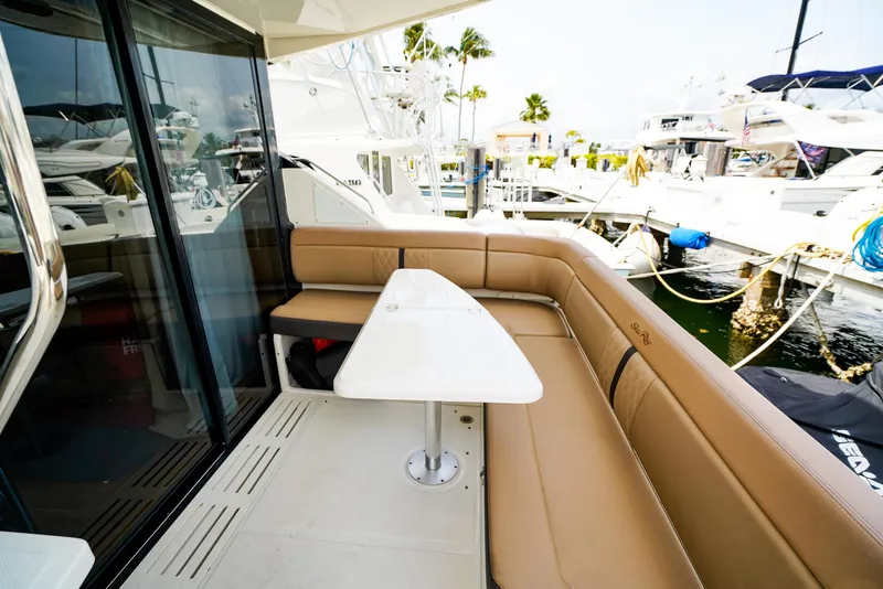 Slide: The Image of Luxurious seating area on 2016 Sea Ray 400 Fly yacht, docked at marina. - 22