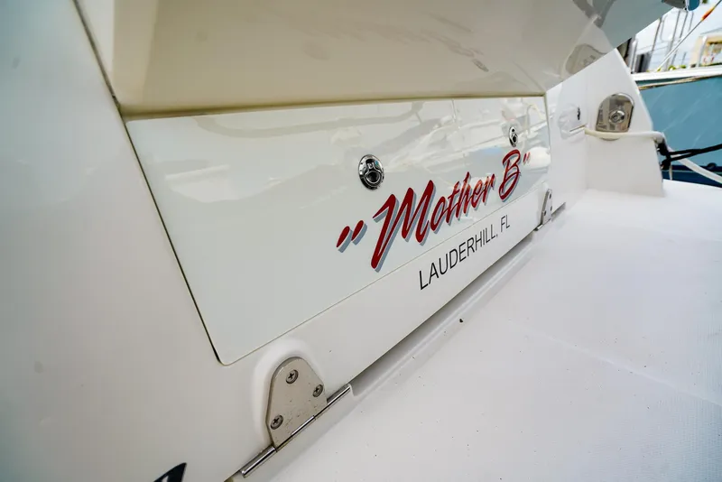 Slide: The Image of 2016 Sea Ray 400 Fly yacht with "Mother B" name, docked in Lauderhill, Florida. - 23