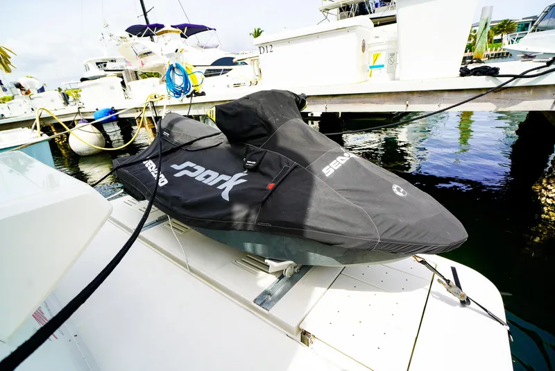 Slide: The Image of Jet ski on a 2016 Sea Ray 400 Fly yacht, docked at a marina. - 24