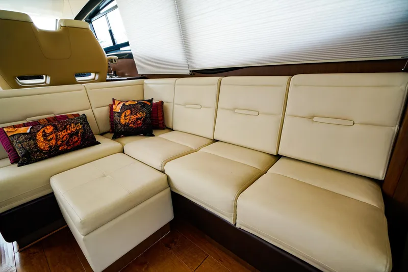 Slide: The Image of Luxurious beige seating area in 2016 Sea Ray 400 Fly yacht interior. - 26