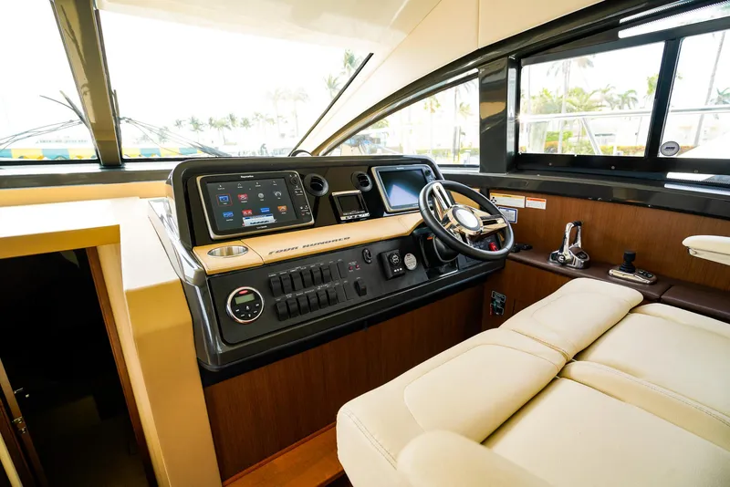 Slide: The Image of Luxurious interior of 2016 Sea Ray 400 Fly yacht with modern helm and plush seating. - 33