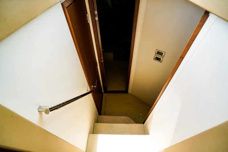 Slide: The Image of Staircase inside 2016 Sea Ray 400 Fly yacht, featuring sleek design and modern finishes. - 36