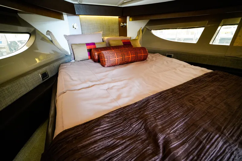 Slide: The Image of Luxurious bedroom interior of 2016 Sea Ray 400 Fly yacht with elegant bedding. - 37