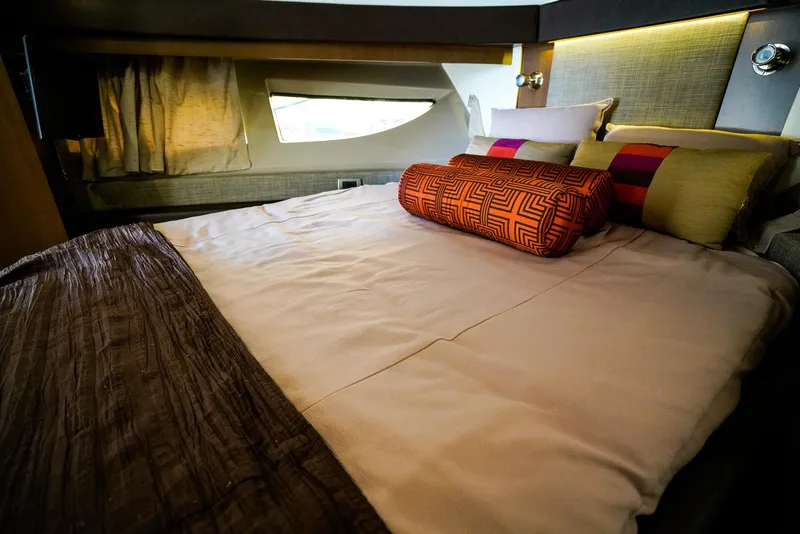 Slide: The Image of Luxurious bedroom interior of 2016 Sea Ray 400 Fly yacht with stylish bedding. - 38