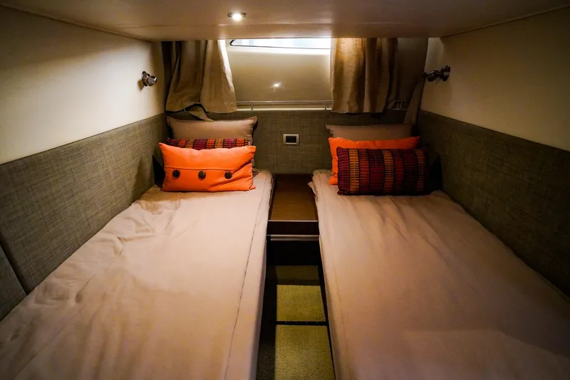 Slide: The Image of Twin cabin interior of 2016 Sea Ray 400 Fly yacht with cozy bedding. - 41