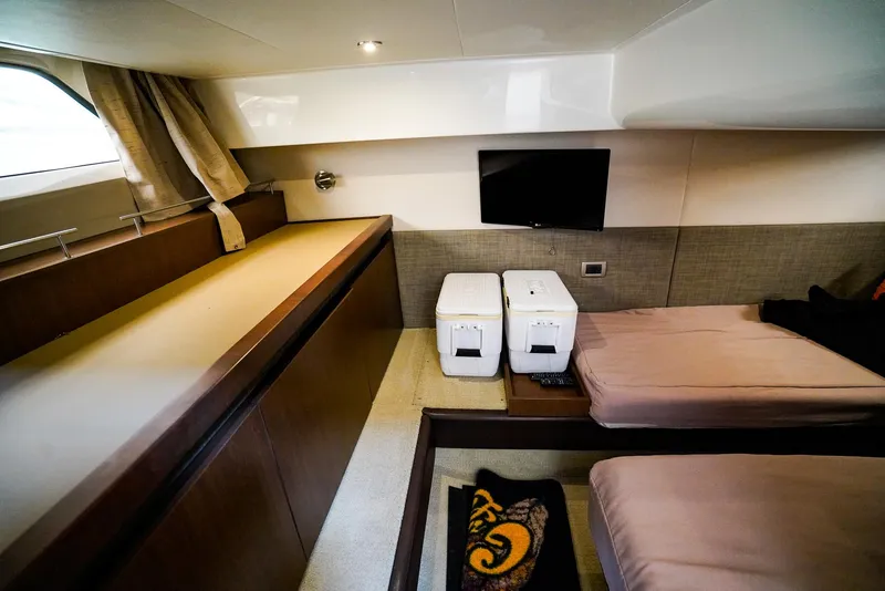 Slide: The Image of Luxurious interior of 2016 Sea Ray 400 Fly yacht with twin beds and modern amenities. - 42