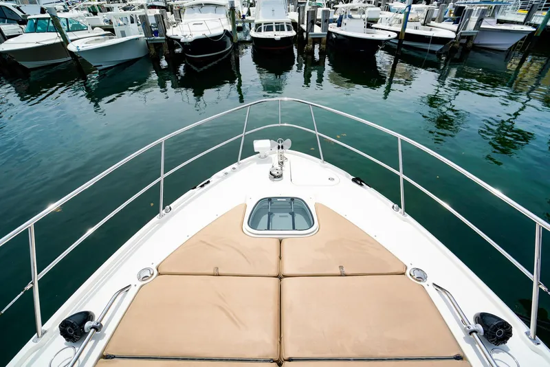 Slide: The Image of Bow view of 2016 Sea Ray 400 Fly yacht docked at marina. - 7