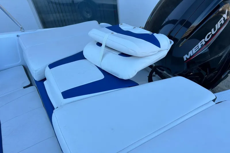 Slide: The Image of 2021 Tahoe 450 TF boat with Mercury engine and cushioned seating. - 7