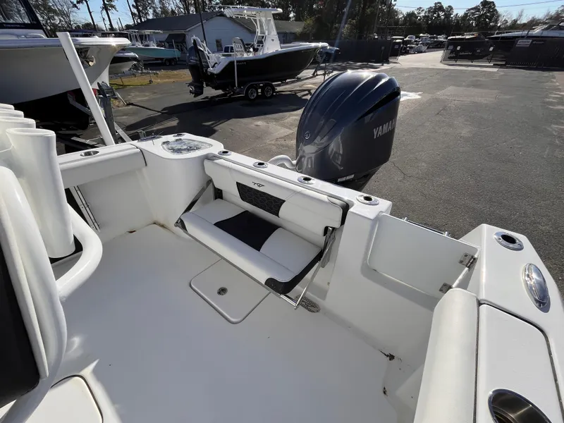 Slide: The Image of 2025 Tidewater 232 CC Adventure boat with Yamaha engine, featuring spacious seating and sleek design. - 7