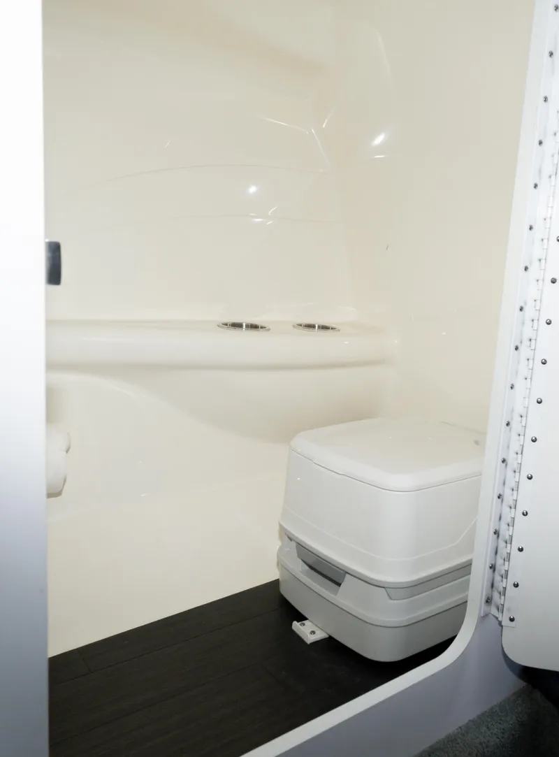 Slide: The Image of 2017 Formula 382 FASTech boat interior bathroom with compact toilet. - 18