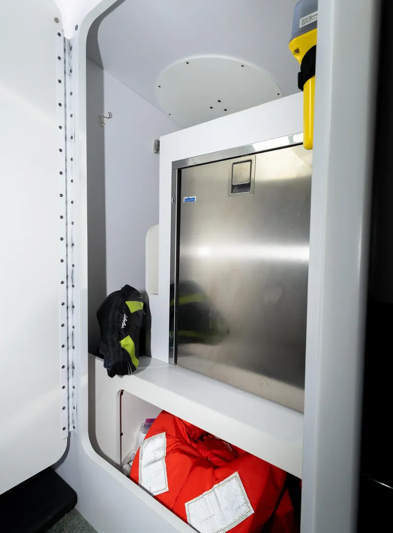 Slide: The Image of Interior of 2017 Formula 382 FASTech boat, featuring storage compartment and safety equipment. - 20