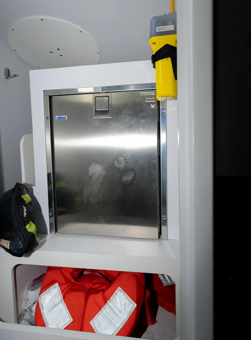 Slide: The Image of 2017 Formula 382 FASTech interior with storage compartment and safety equipment. - 21