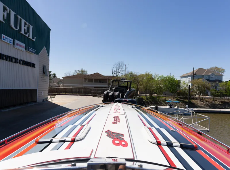 Slide: The Image of 2017 Formula 382 FASTech boat docked near fuel service center, vibrant design visible. - 25