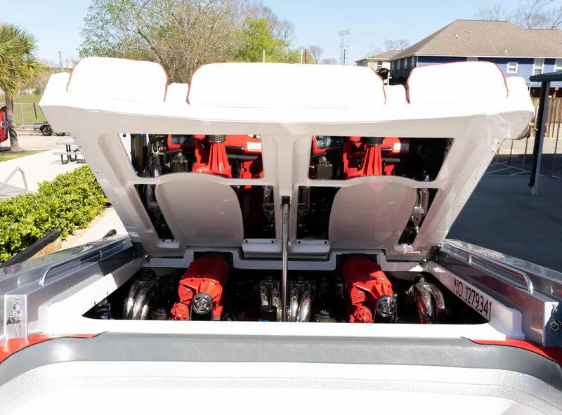 Slide: The Image of 2017 Formula 382 FASTech boat engine compartment with open hatch, showcasing powerful red engines. - 26