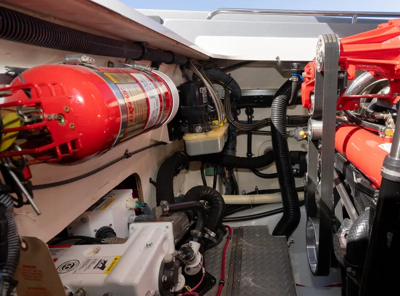 Slide: The Image of Engine compartment of a 2017 Formula 382 FASTech boat, featuring fire extinguisher and mechanical components. - 28