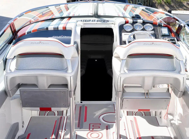 Slide: The Image of 2017 Formula 382 FASTech boat interior with dual seats and dashboard controls. - 4