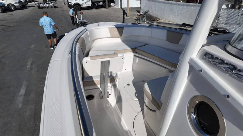 Slide: The Image of 2025 Robalo 232 Explorer boat interior with seating and deck details. - 4