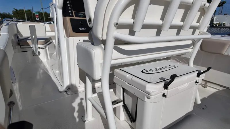 Slide: The Image of 2025 Robalo 232 Explorer boat interior with seating and storage features. - 6