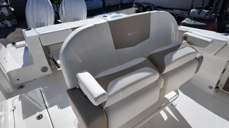 Slide: The Image of 2025 Robalo R250 boat seating with dual outboard engines in the background. - 12