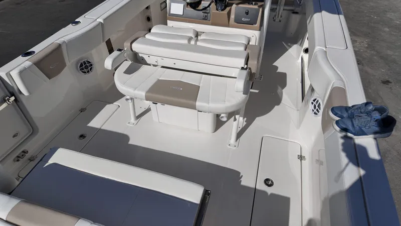 Slide: The Image of 2025 Robalo R250 boat interior with seating and storage compartments. - 14