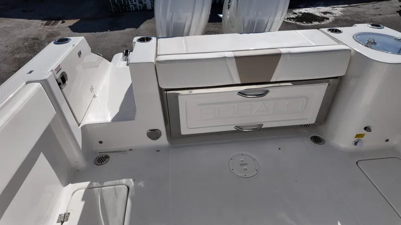 Slide: The Image of 2025 Robalo R250 boat interior with seating and storage compartments. - 17