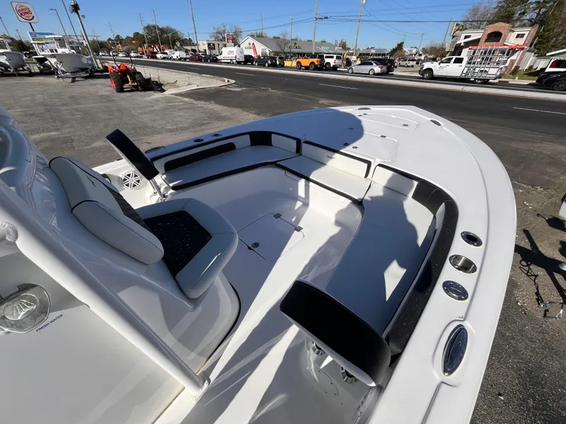 Slide: The Image of 2025 Tidewater 2300 Carolina Bay boat interior with seating and cup holders. - 10