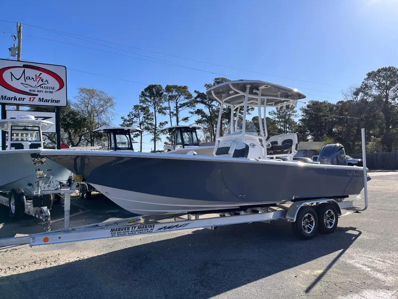 Slide: The Image of 2025 Tidewater 2300 Carolina Bay boat on trailer at Marker 17 Marine dealership. - 2