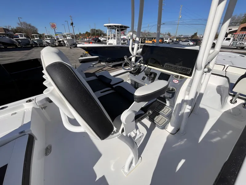 Slide: The Image of 2025 Tidewater 2300 Carolina Bay boat interior with modern helm and seating. - 7