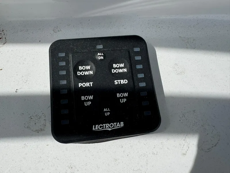 Slide: The Image of Control panel for Lectrotab trim tabs on a 2019 Everglades 273 CC boat. - 21