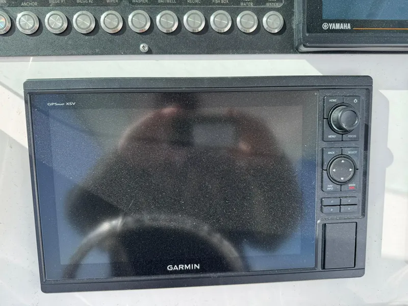 Slide: The Image of Garmin GPS display on 2019 Everglades 273 CC boat dashboard. - 25
