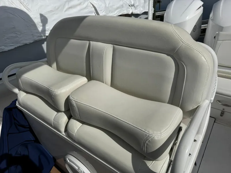 Slide: The Image of White cushioned seating on 2019 Everglades 273 CC boat, featuring ergonomic design. - 33